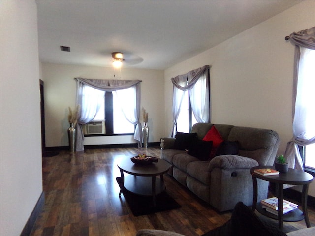 413 Paulus St, Schulenburg, TX 78956 - living area with wood finished floors, ceiling fan, baseboards, and cooling unit