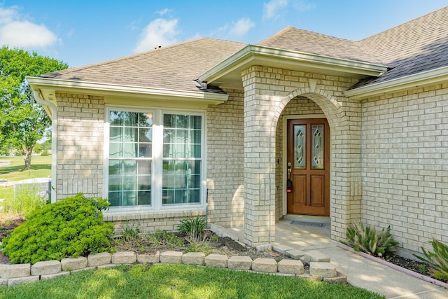 606 Redwood Bend Ln, Pearland, TX 77584 - entrance to property with a shingled roof and brick siding