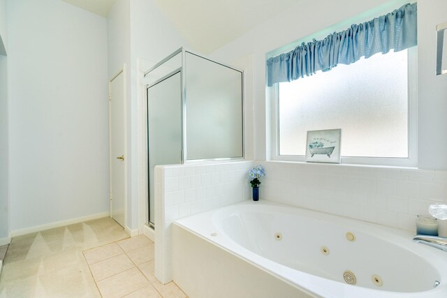 606 Redwood Bend Ln, Pearland, TX 77584 - full bathroom with a tub with jets, a shower stall, and baseboards