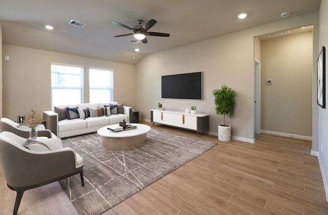 3217 21st St N, Texas City, TX 77590 - living room with light wood finished floors, a ceiling fan, baseboards, and recessed lighting