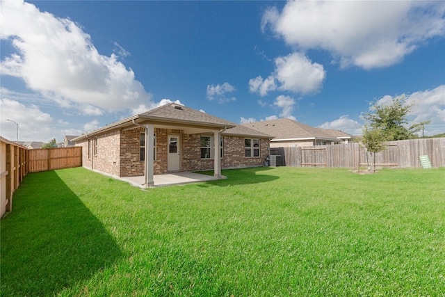 3217 21st St N, Texas City, TX 77590 - back of property with brick siding, a patio, and roof with shingles
