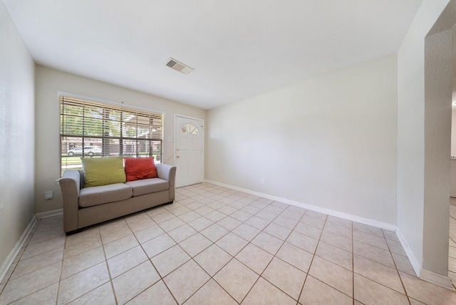 9215 Linda Vista Rd, Houston, TX 77078 - living room featuring light tile patterned floors and baseboards
