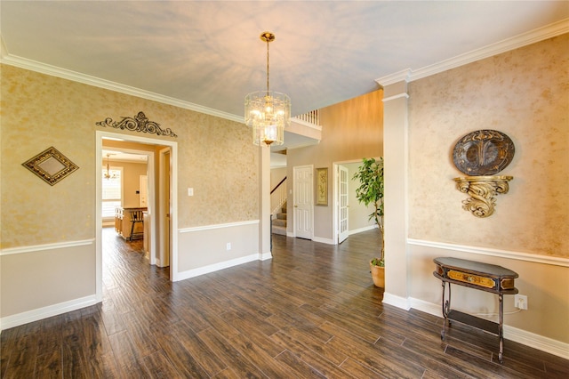 7610 Cedar Jump Dr, Humble, TX 77346 - spare room with a chandelier, stairway, dark wood-style flooring, ornamental molding, and baseboards
