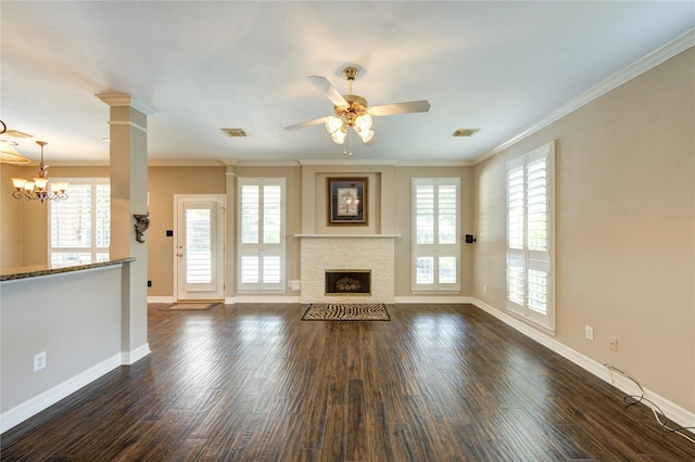 7610 Cedar Jump Dr, Humble, TX 77346 - unfurnished living room featuring plenty of natural light, baseboards, dark wood finished floors, and crown molding