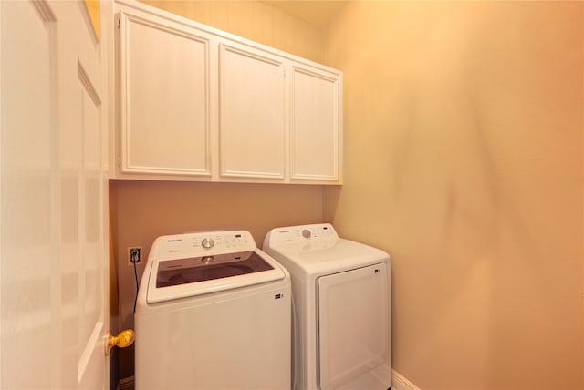 7610 Cedar Jump Dr, Humble, TX 77346 - clothes washing area with cabinet space and independent washer and dryer