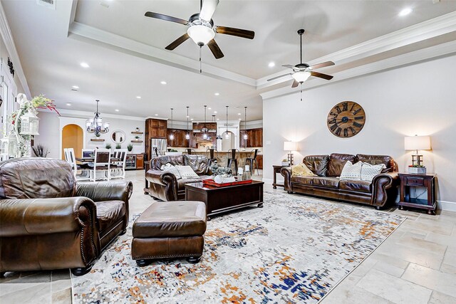 32811 Warbler Ct, Fulshear, TX 77441 - living area with ceiling fan, a tray ceiling, stone tile flooring, recessed lighting, and a chandelier