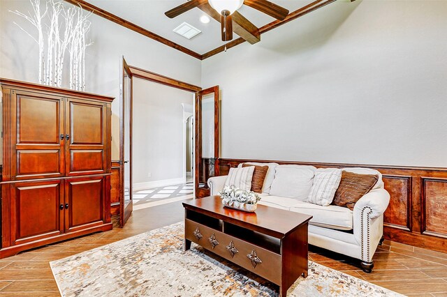 32811 Warbler Ct, Fulshear, TX 77441 - living room with crown molding, ceiling fan, wood finished floors, and wainscoting