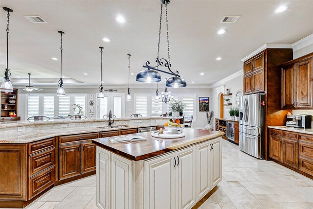32811 Warbler Ct, Fulshear, TX 77441 - kitchen featuring appliances with stainless steel finishes, a large island, recessed lighting, a sink, and decorative backsplash