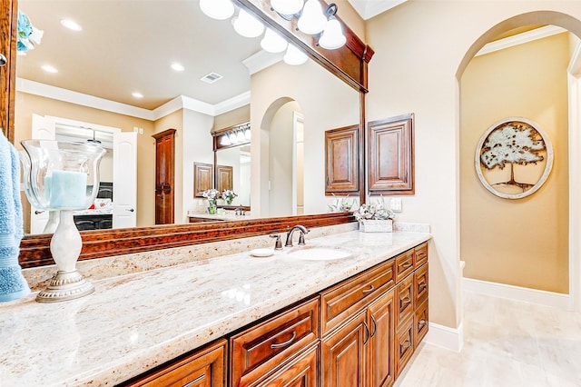 32811 Warbler Ct, Fulshear, TX 77441 - bathroom with crown molding, vanity, baseboards, and recessed lighting