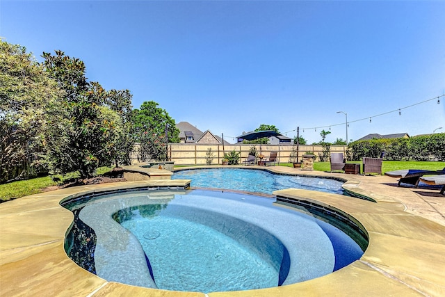 32811 Warbler Ct, Fulshear, TX 77441 - view of pool featuring a fenced backyard, a patio area, and a pool with connected hot tub