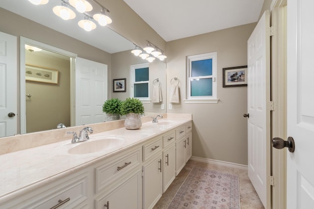 20103 Diamond Ct, Magnolia, TX 77355 - bathroom featuring double vanity and baseboards