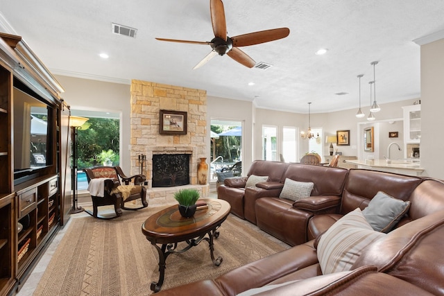 20103 Diamond Ct, Magnolia, TX 77355 - living area with a ceiling fan, a stone fireplace, recessed lighting, and ornamental molding