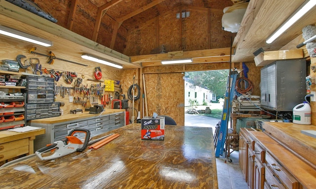 20103 Diamond Ct, Magnolia, TX 77355 - miscellaneous room featuring a workshop area and high vaulted ceiling