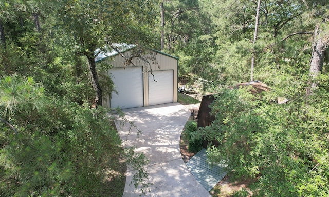 20103 Diamond Ct, Magnolia, TX 77355 - detached garage with a wooded view
