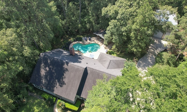 20103 Diamond Ct, Magnolia, TX 77355 - view from above of property featuring a pool and a heavily wooded area