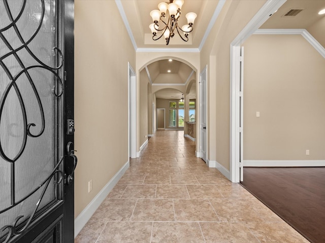 4410 Cobalt Cross St, Katy, TX 77493 - entrance foyer featuring arched walkways, a chandelier, baseboards, and crown molding
