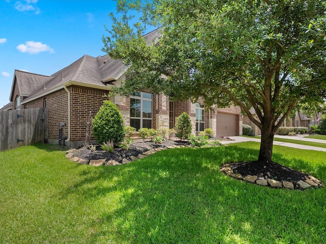 4410 Cobalt Cross St, Katy, TX 77493 - view of property hidden behind natural elements featuring brick siding, a shingled roof, an attached garage, and concrete driveway