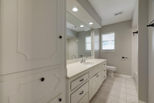 bathroom with toilet, baseboards, vanity, tile patterned floors, and recessed lighting