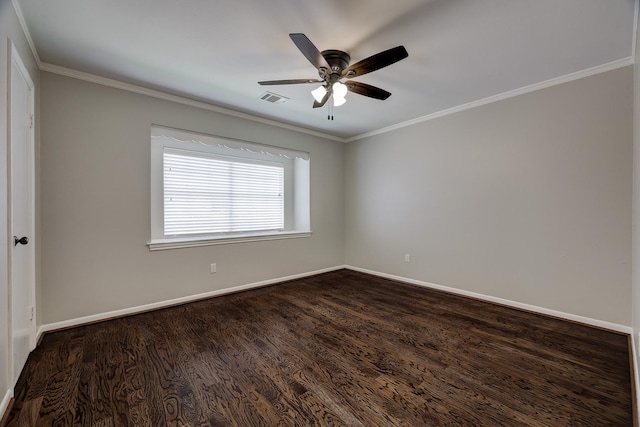empty room with dark wood-style flooring, ornamental molding, ceiling fan, and baseboards