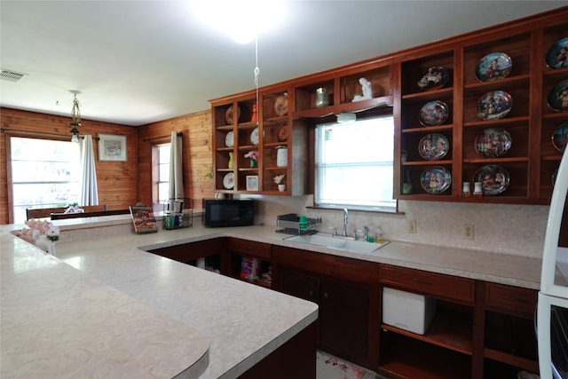 215 Weldon, Livingston, TX 77351 - kitchen with open shelves, a sink, black microwave, and light countertops