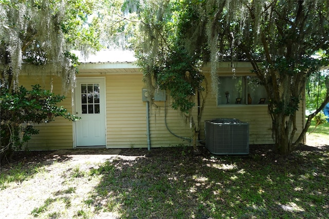 215 Weldon, Livingston, TX 77351 - rear view of property with cooling unit