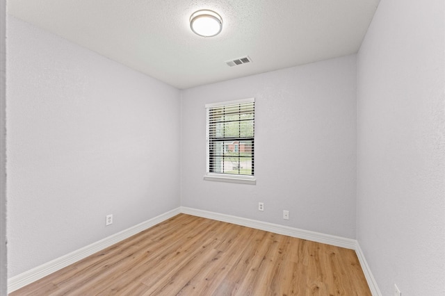6105 Arthington St, Houston, TX 77053 - empty room with light wood-style flooring and baseboards