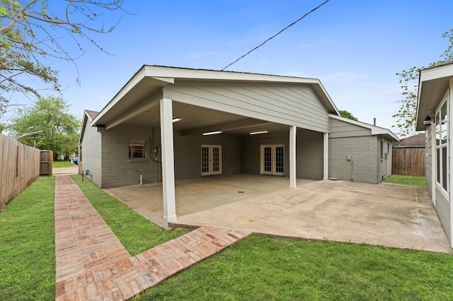 6105 Arthington St, Houston, TX 77053 - rear view of house with french doors, brick siding, and a patio area
