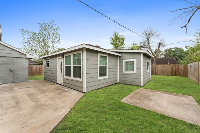 6105 Arthington St, Houston, TX 77053 - rear view of house with a patio area