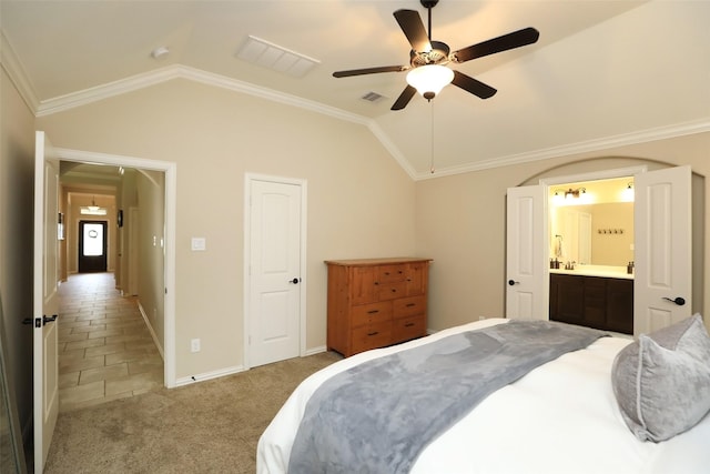 bedroom featuring vaulted ceiling, baseboards, a ceiling fan, ornamental molding, and connected bathroom