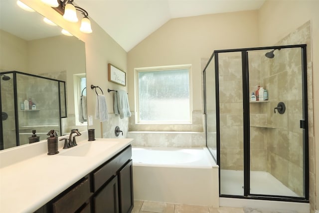 full bathroom with a shower stall, a garden tub, vanity, and vaulted ceiling