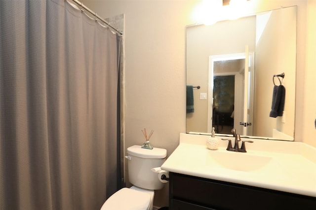 full bathroom featuring vanity and toilet