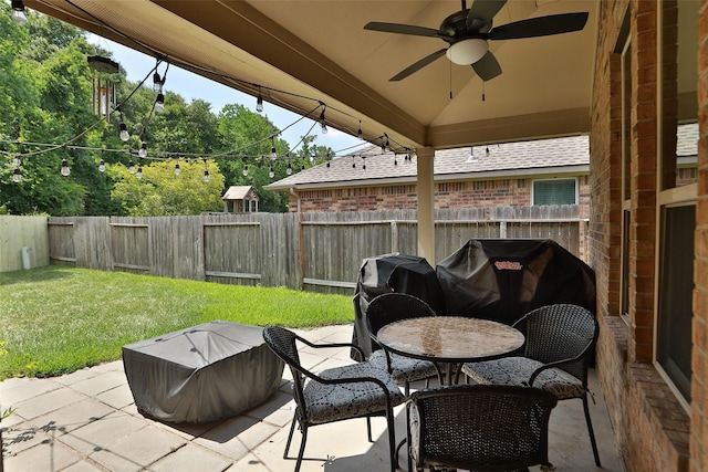 view of patio with ceiling fan and outdoor dining area
