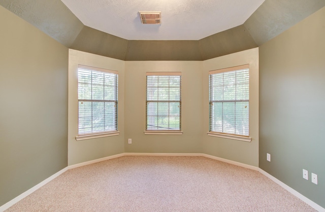 10711 Sea Myrtle Dr, Houston, TX 77095 - empty room with carpet floors, baseboards, and a textured ceiling