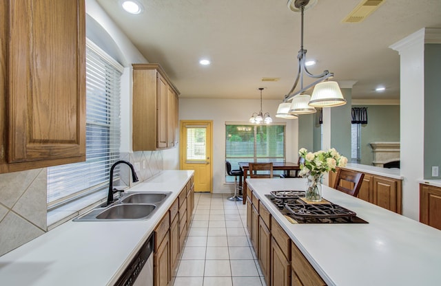 10711 Sea Myrtle Dr, Houston, TX 77095 - kitchen with a sink, black gas cooktop, light countertops, decorative backsplash, and decorative light fixtures