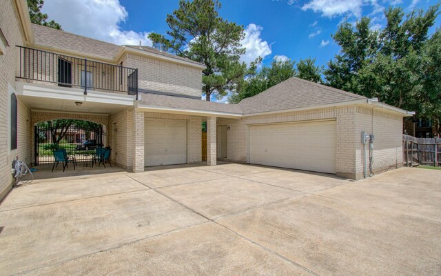 10711 Sea Myrtle Dr, Houston, TX 77095 - garage featuring driveway and fence
