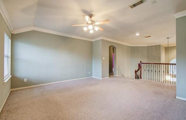 10711 Sea Myrtle Dr, Houston, TX 77095 - carpeted spare room featuring a ceiling fan, arched walkways, healthy amount of natural light, ornamental molding, and baseboards