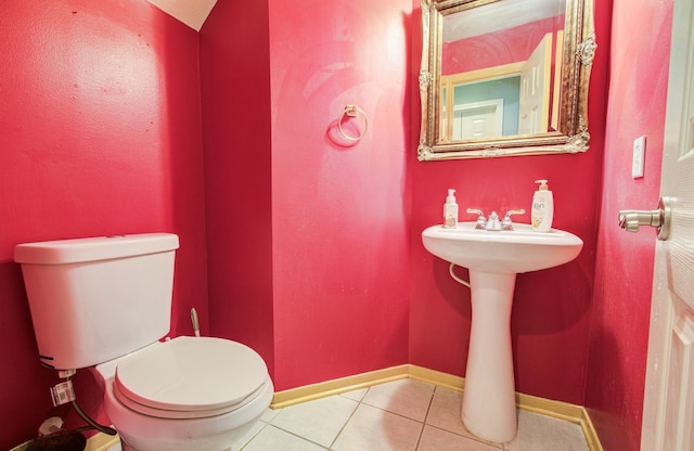 10711 Sea Myrtle Dr, Houston, TX 77095 - bathroom with tile patterned floors, toilet, baseboards, and a sink