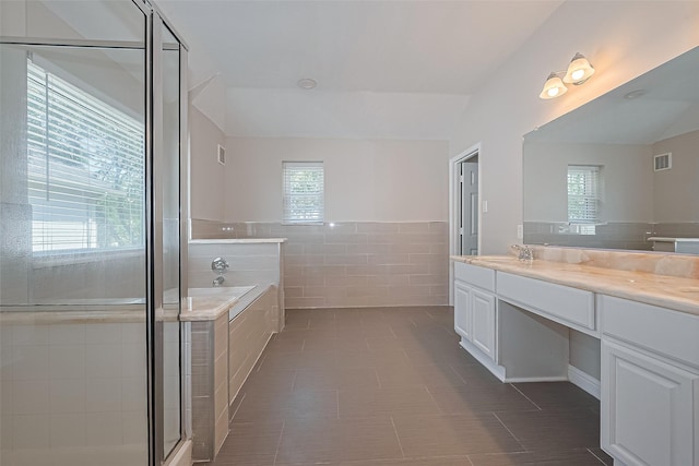 5714 Ames Xing, Sugar Land, TX 77479 - full bathroom with tile walls, a bath, double vanity, tile patterned flooring, and a shower with door