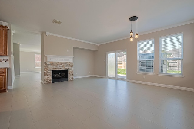 5714 Ames Xing, Sugar Land, TX 77479 - unfurnished living room featuring crown molding, baseboards, and a stone fireplace
