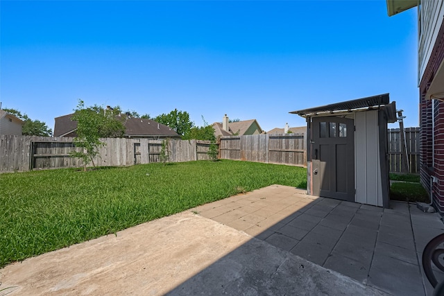 5714 Ames Xing, Sugar Land, TX 77479 - view of yard featuring a patio, a storage shed, and an outbuilding