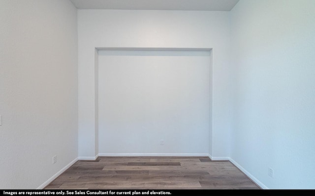2443 Solaris Bend Dr, Katy, TX 77493 - spare room featuring wood finished floors and baseboards
