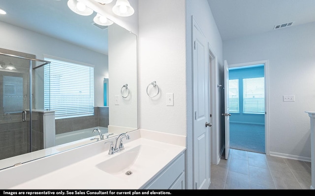 2443 Solaris Bend Dr, Katy, TX 77493 - full bath with a shower stall, vanity, tile patterned flooring, a garden tub, and baseboards