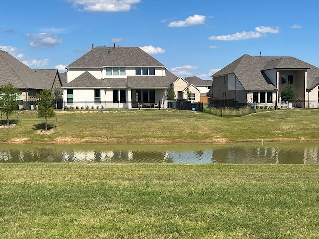 2443 Solaris Bend Dr, Katy, TX 77493 - back of property featuring a water view and a shingled roof