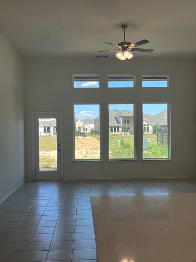 2443 Solaris Bend Dr, Katy, TX 77493 - tiled empty room with ceiling fan and baseboards