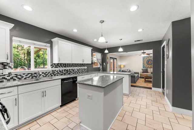 32123 Willow Creek Park, Conroe, TX 77385 - kitchen featuring black dishwasher, a sink, tasteful backsplash, a peninsula, and recessed lighting