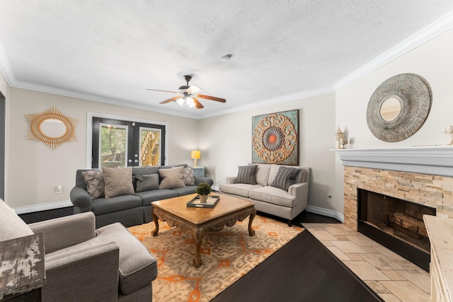 32123 Willow Creek Park, Conroe, TX 77385 - living room featuring crown molding, a ceiling fan, light wood-style flooring, a fireplace, and baseboards