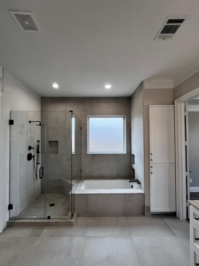 bathroom with a shower stall, a bath, vanity, crown molding, and recessed lighting