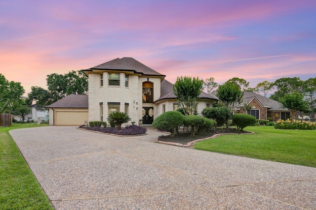 2616 Ryder Ct, League City, TX 77573 - view of front of home with driveway, an attached garage, a front yard, roof with shingles, and brick siding
