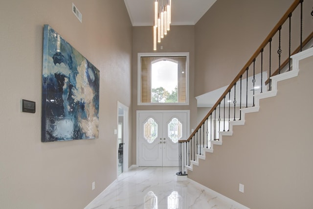 2616 Ryder Ct, League City, TX 77573 - entrance foyer with stairway, a towering ceiling, marble tiled floors, a chandelier, and baseboards