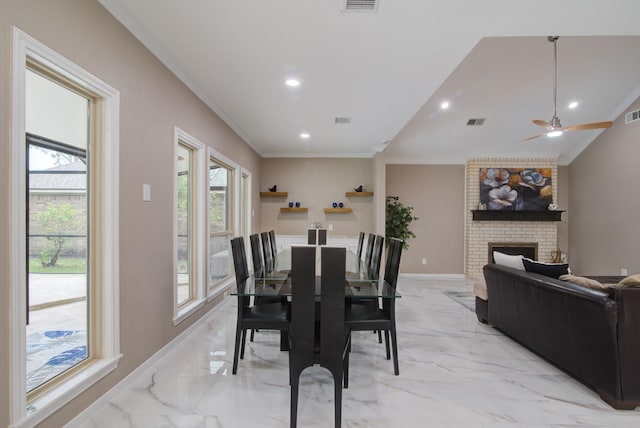 2616 Ryder Ct, League City, TX 77573 - dining room featuring light marble finish floors, crown molding, a fireplace, recessed lighting, and baseboards